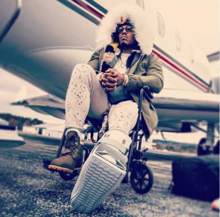 Newton posing in-front of a private jet